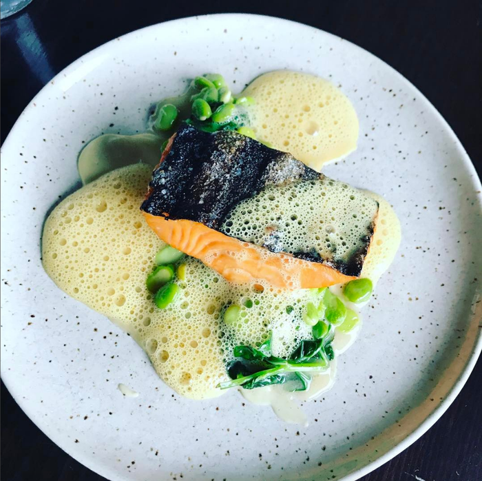 Arctic char with spring beans, fava leaves, sour curry and ajo blanco